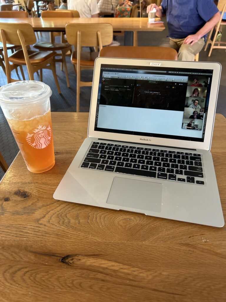 MacBook Air and a lemonade on a table in Starbucks 